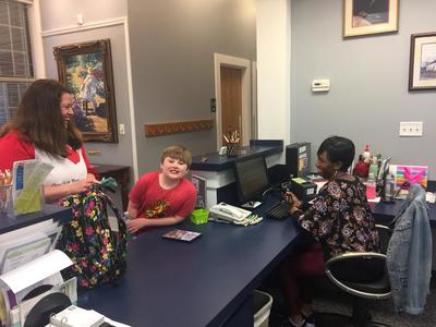 Front Desk with Smiling Boy