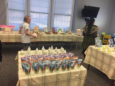 Girl Getting Book Tasting Snacks